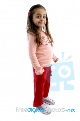 Child Standing With Hand In Pocket Stock Photo