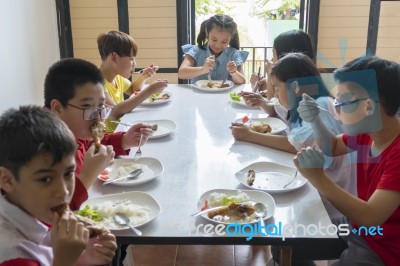 Children Eating Together Stock Photo