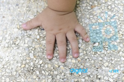 Children Hand On Gravel Stock Photo