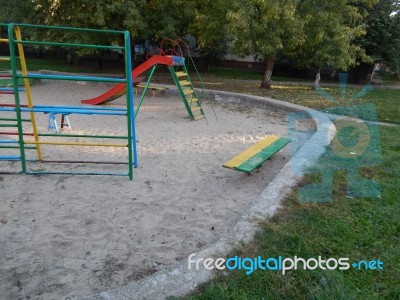 Children Playground, Swing Near The House  Stock Photo