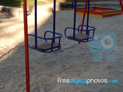 Children Playground, Swing Near The House  Stock Photo