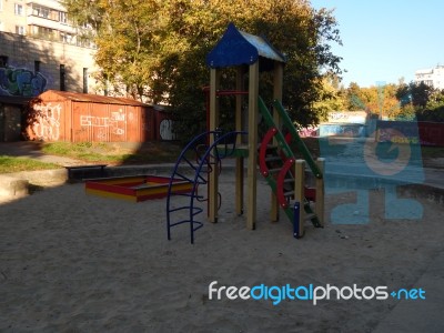 Children Playground, Swing Near The House  Stock Photo