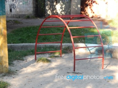 Children Playground, Swing Near The House  Stock Photo