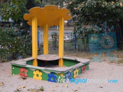 Children Playground, Swing Near The House  Stock Photo