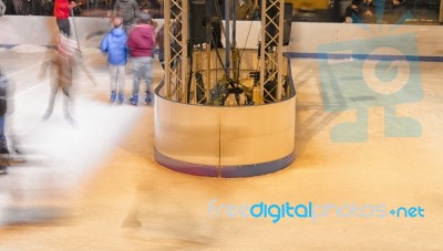 Children Skating On The Ice Rink Stock Photo