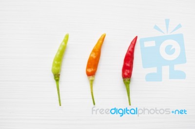 Chili Peppers On White Stock Photo