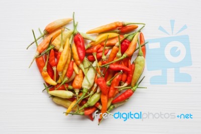 Chili Peppers On White Stock Photo