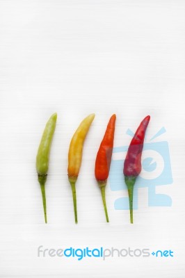 Chili Peppers On White Stock Photo