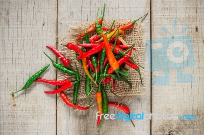 Chilli On Wooden Floor Stock Photo