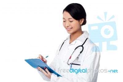 Chinese Doctor Standing With Folder Stock Photo