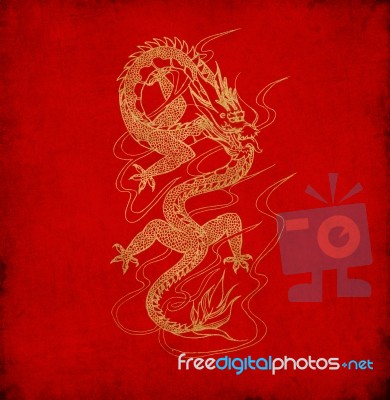 Chinese Dragon On Old Red Paper Background  Stock Image