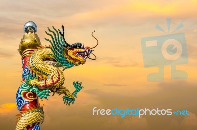 Chinese Dragon On The Ploe Stock Photo