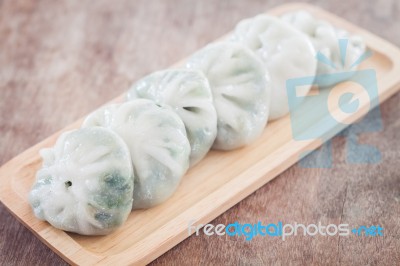 Chinese Leek Steamed Dessert On Wooden Table Stock Photo