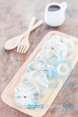 Chinese Leek Steamed Dessert On Wooden Table Stock Photo