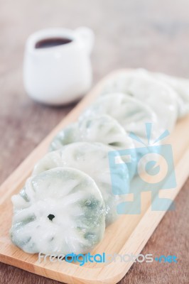 Chinese Leek Steamed Dessert On Wooden Table Stock Photo