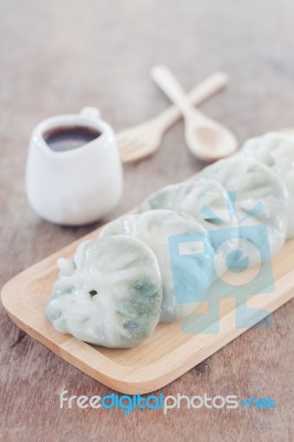 Chinese Leek Steamed Dessert On Wooden Table Stock Photo