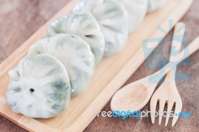 Chinese Leek Steamed Dessert On Wooden Table Stock Photo