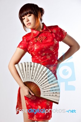 Chinese Model In Traditional Cheongsam Dress Stock Photo