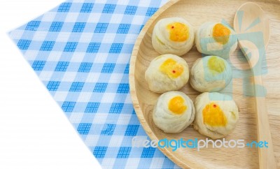 Chinese Pastry Mung Bean Or Mooncake With Egg Yolk On Wooden Dish And Spoon Striped Cloth Stock Photo