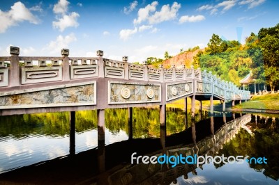 Chinese Style Bridge On The River Stock Photo