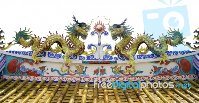 Chinese Style Dragon Statue At Roof Of Temple Stock Photo