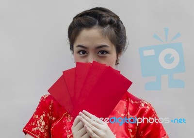 Chinese Woman Holding Red Envelopes Stock Photo