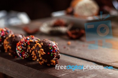 Chocolate Ball On A Wooden Stock Photo