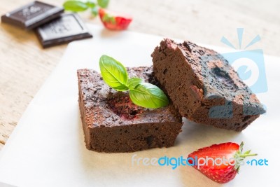 Chocolate Brownie Cake Decorated With Strawberries. Selective Fo… Stock Photo