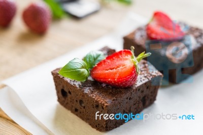 Chocolate Brownie Cake Decorated With Strawberries. Selective Fo… Stock Photo