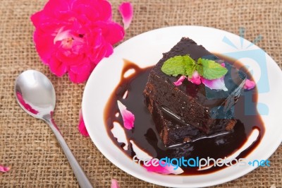 Chocolate Brownie On Plate With Rose Petals Stock Photo