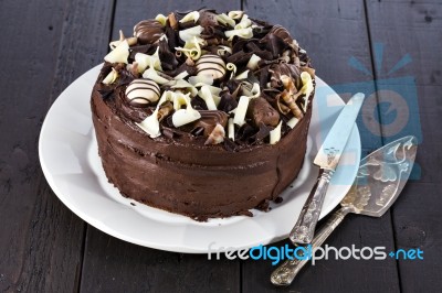 Chocolate Cake With Shovel And Cutting Knife Stock Photo