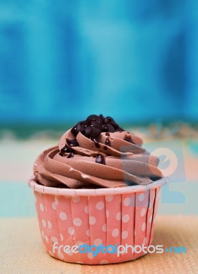 Chocolate Cup Cake On Table Clothes Stock Photo