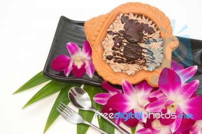 Chocolate Cupcakes In Clay Pot With Thai Orchid Stock Photo