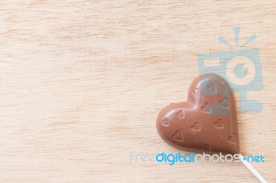 Chocolate Hearts Candies On Wooden Background Stock Photo