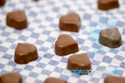 Chocolate Hearts On Fabric Stock Photo