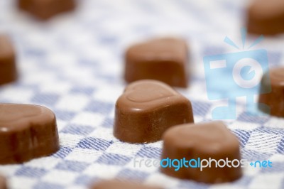 Chocolate Hearts On Fabric Stock Photo