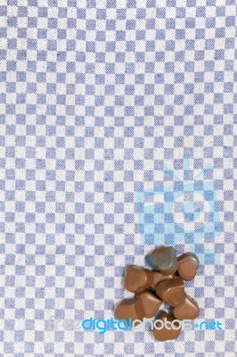 Chocolate Hearts On Fabric Stock Photo