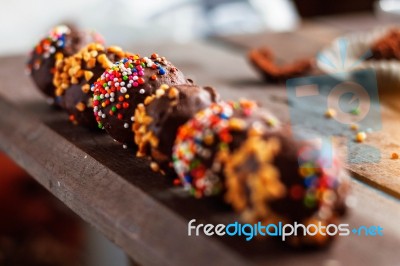 Chocolate Of Colorful On Wooden Stock Photo