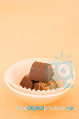 Chocolate Pieces On On Warm Vintage Background Stock Photo