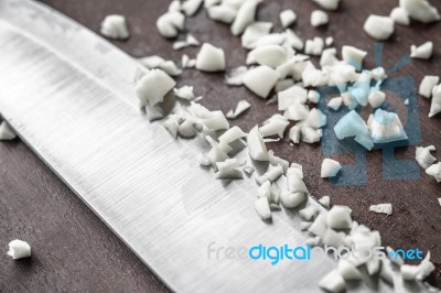 Chopped Onion With Knife On The Wooden Board Stock Photo