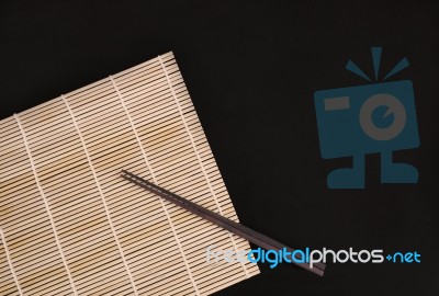 Chopsticks On Bamboo Matt Stock Photo