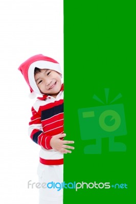 Christmas Asian Boy With Empty Banner Stock Photo