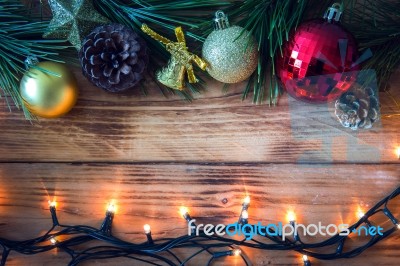 Christmas Background With Christmas Gift,red Balls, Pine Cones On Wooden Background. Christmas Vintage Style Stock Photo