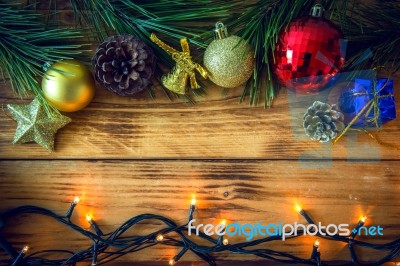 Christmas Background With Christmas Gift,red Balls, Pine Cones On Wooden Background. Christmas Vintage Style Stock Photo