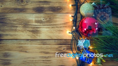 Christmas Background With Christmas Gift,red Balls, Pine Cones On Wooden Background. Christmas Vintage Style Stock Photo