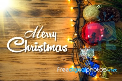 Christmas Background With Christmas Gift,red Balls, Pine Cones On Wooden Background. Christmas Vintage Style Stock Photo