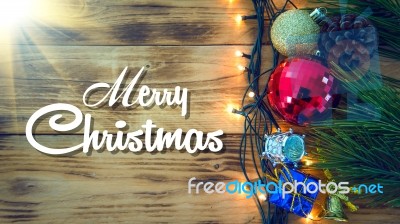 Christmas Background With Christmas Gift,red Balls, Pine Cones On Wooden Background. Christmas Vintage Style Stock Photo