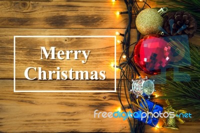 Christmas Background With Christmas Gift,red Balls, Pine Cones On Wooden Background. Christmas Vintage Style Stock Photo