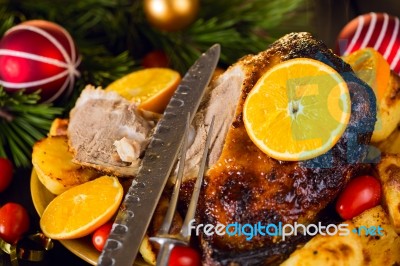 Christmas Baked Duck Served With Potatoes, Orange And Tomatoes Stock Photo