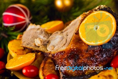 Christmas Baked Duck Served With Potatoes, Orange And Tomatoes Stock Photo